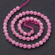 Runde rosakvarts perler på streng